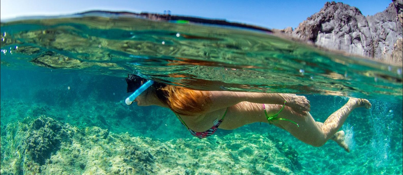 A woman snorkelling in the Mediterranean