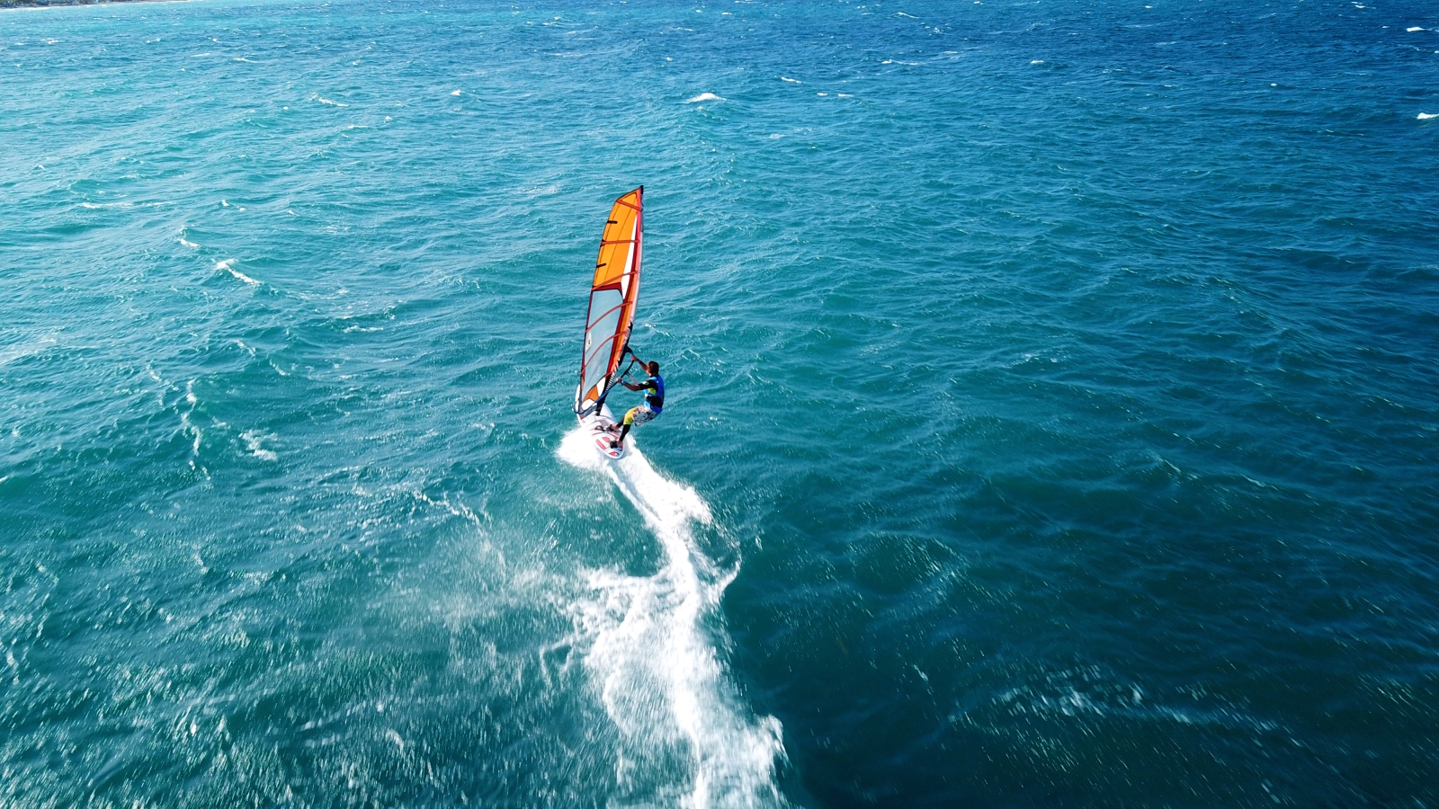 Man windsurfing in turquoise waters