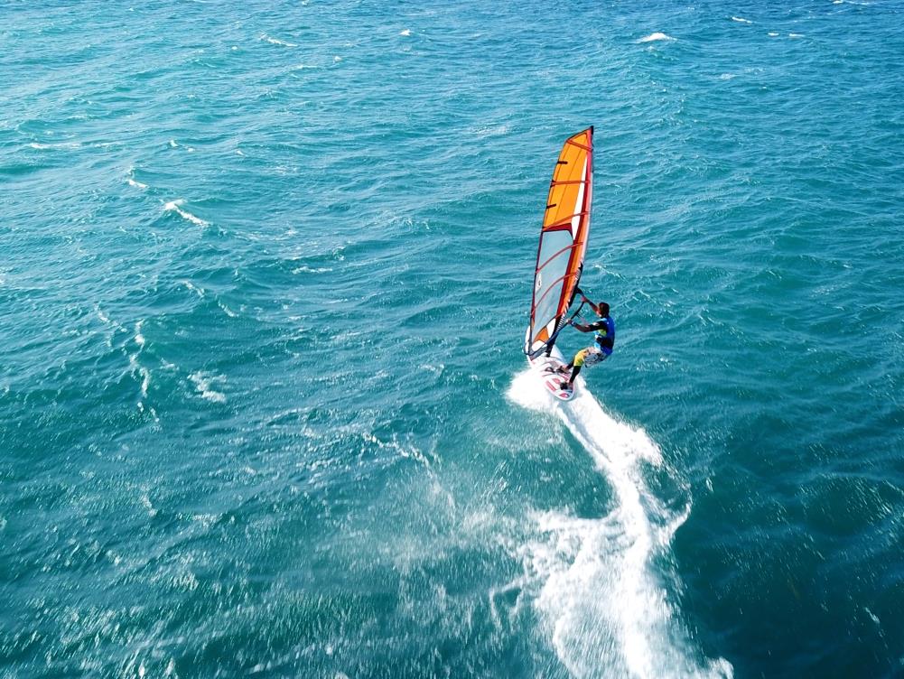 Man windsurfing in turquoise waters