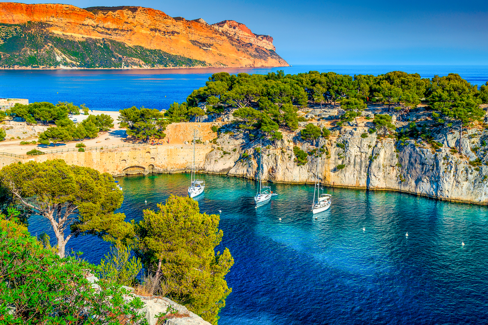 Boats moored in a bay in Calanques
