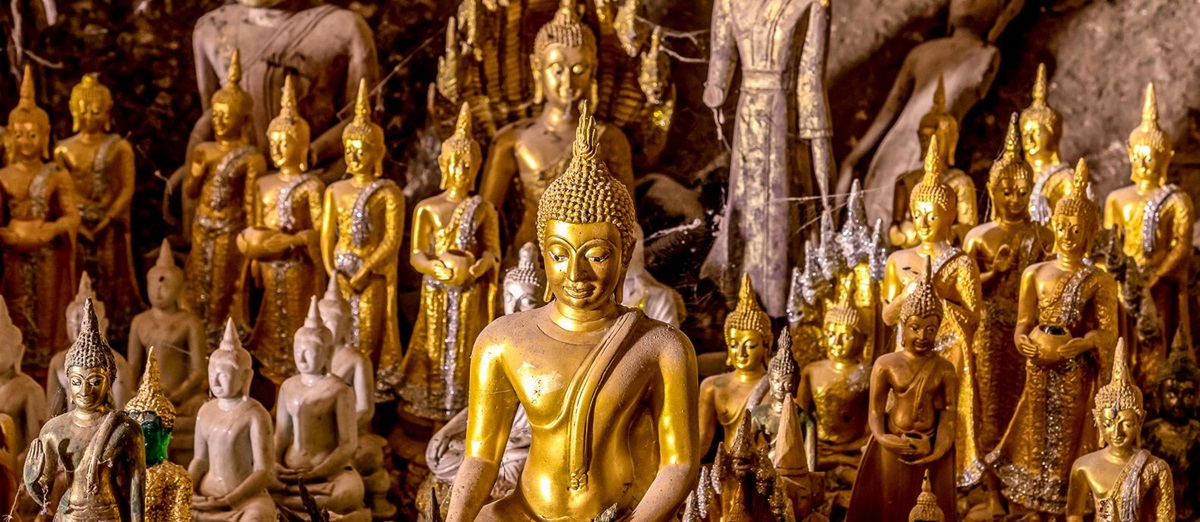 Golden Buddha statues in Pak Ou caves in Laos