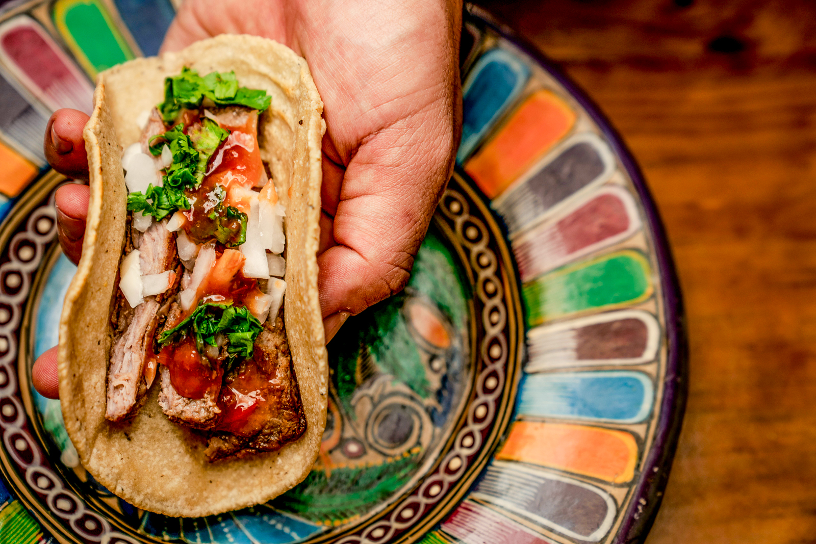 A taco served on a painted plate in Mexico