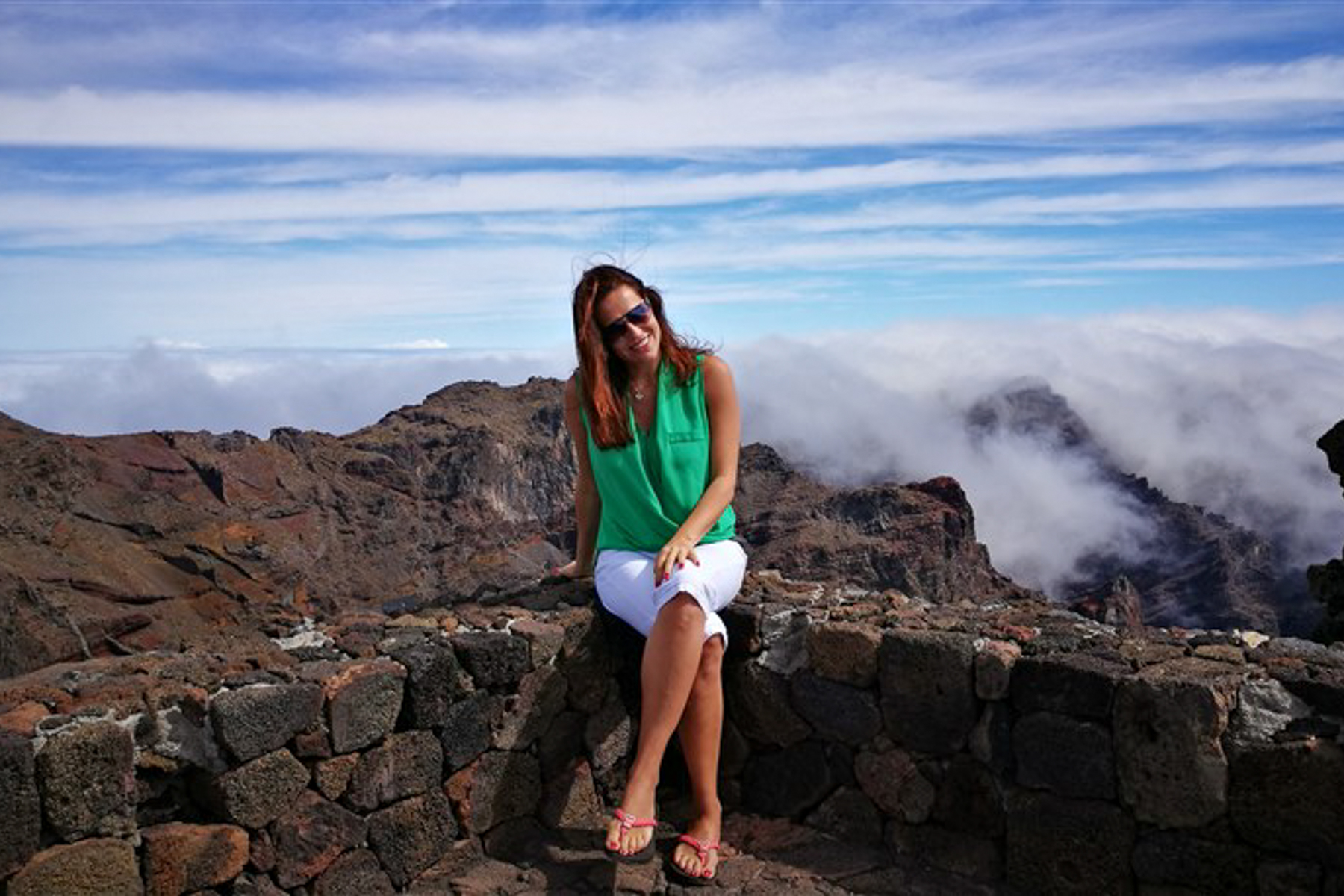 Barbara Janicka, Red Savannah's Europe travel specialist, against a mountain backdrop