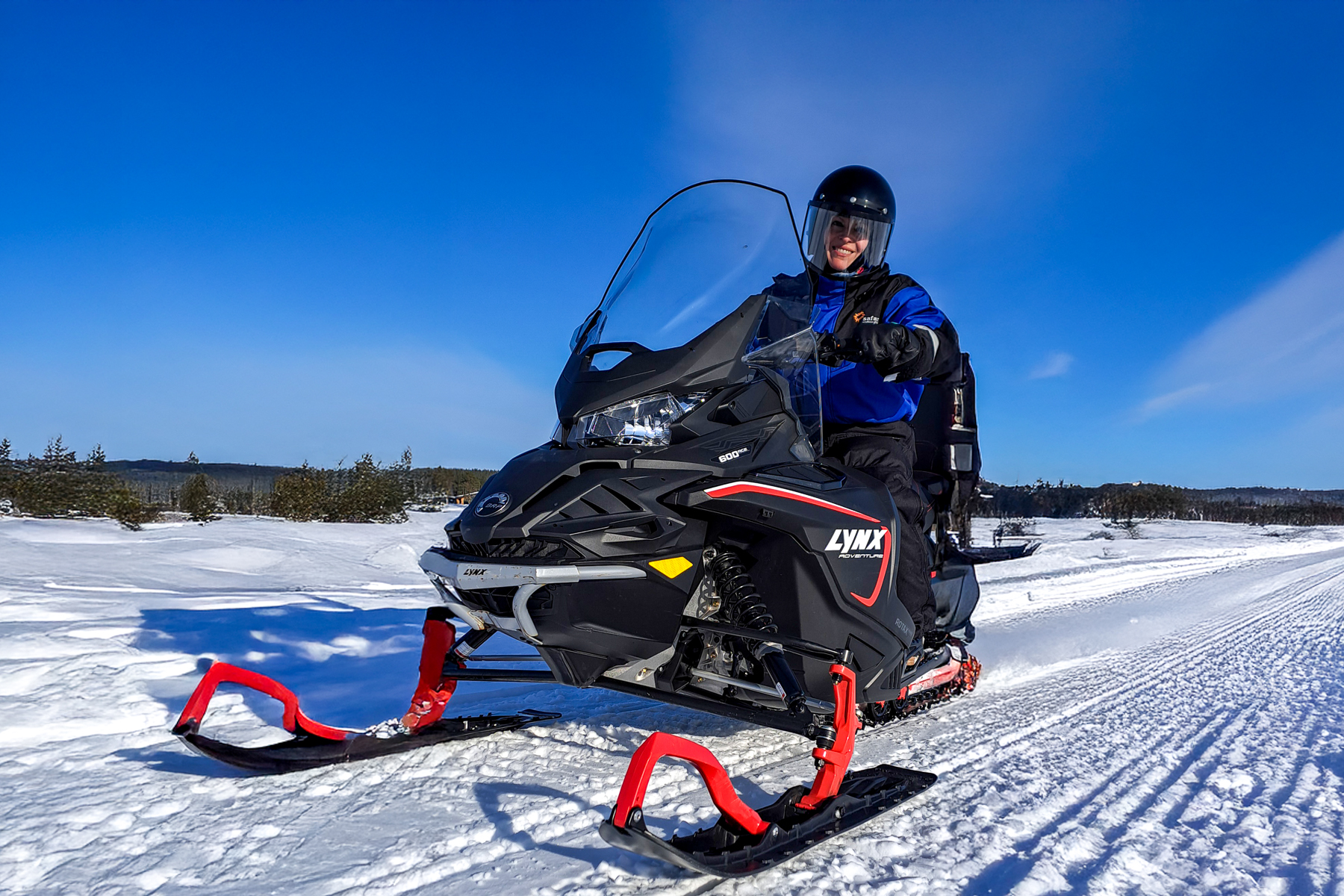 Barbara Janicka, Red Savannah's Europe travel specialist, on snowmobile