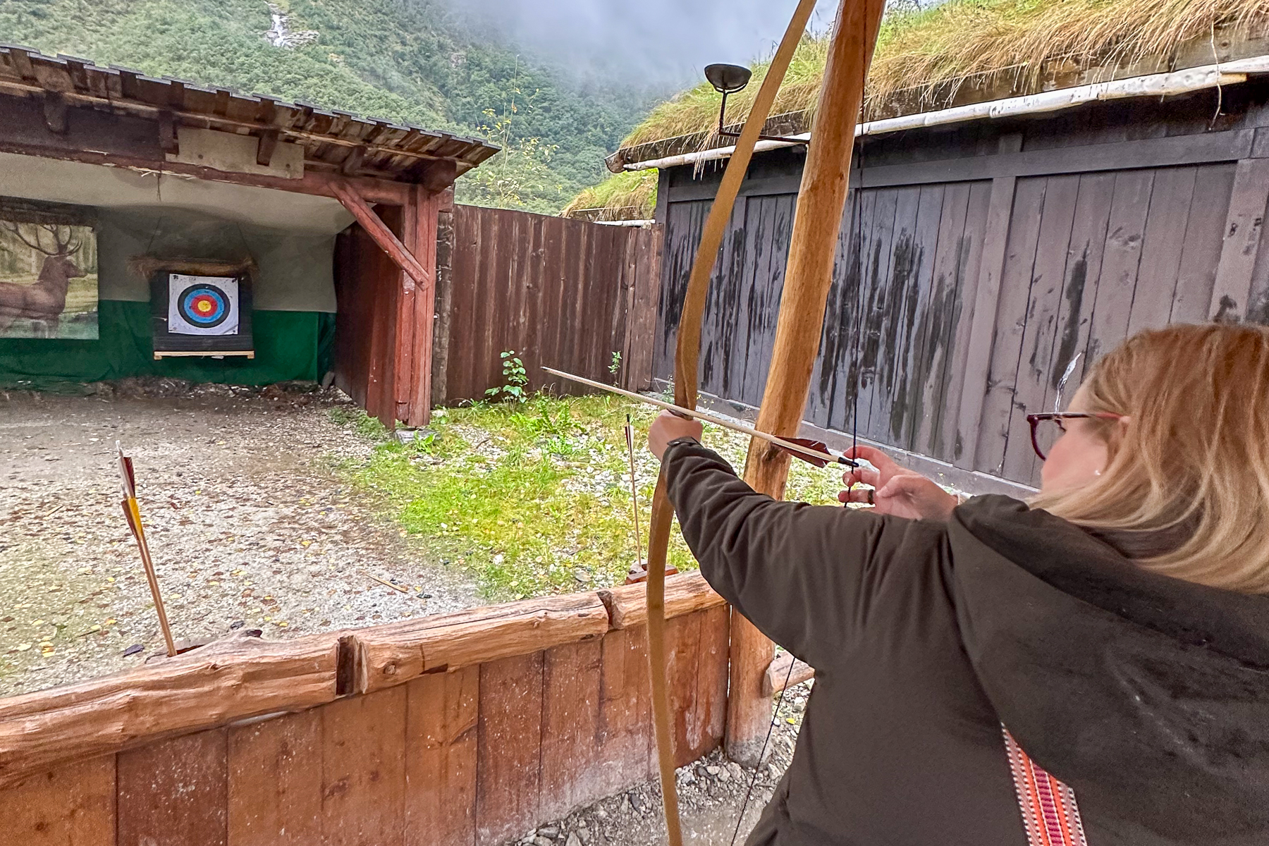 Clare Watkins, Red Savannah's Europe specialist, trying archery in Scandinavia