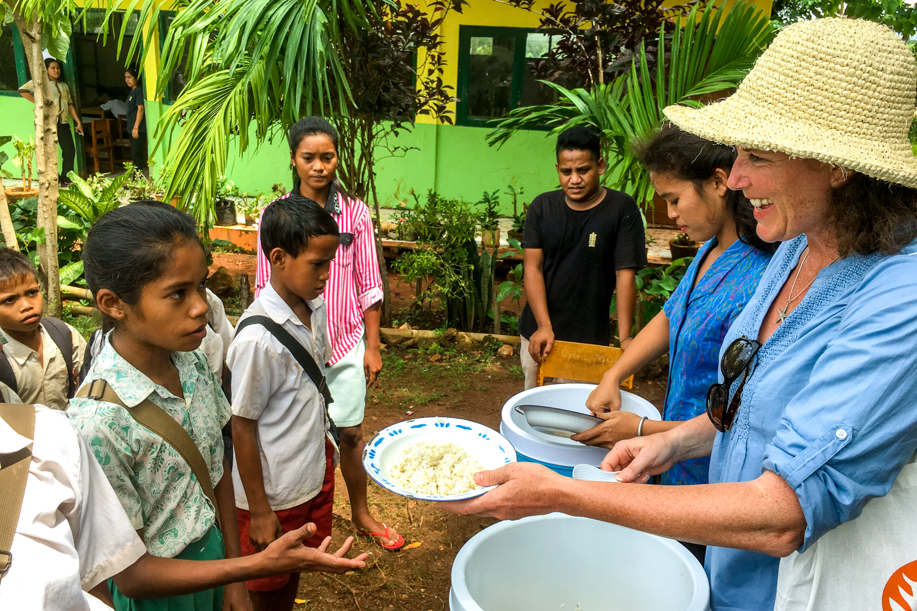 Mel Matthews, Red Savannah's southeast Asia specialist, assisting with school meals