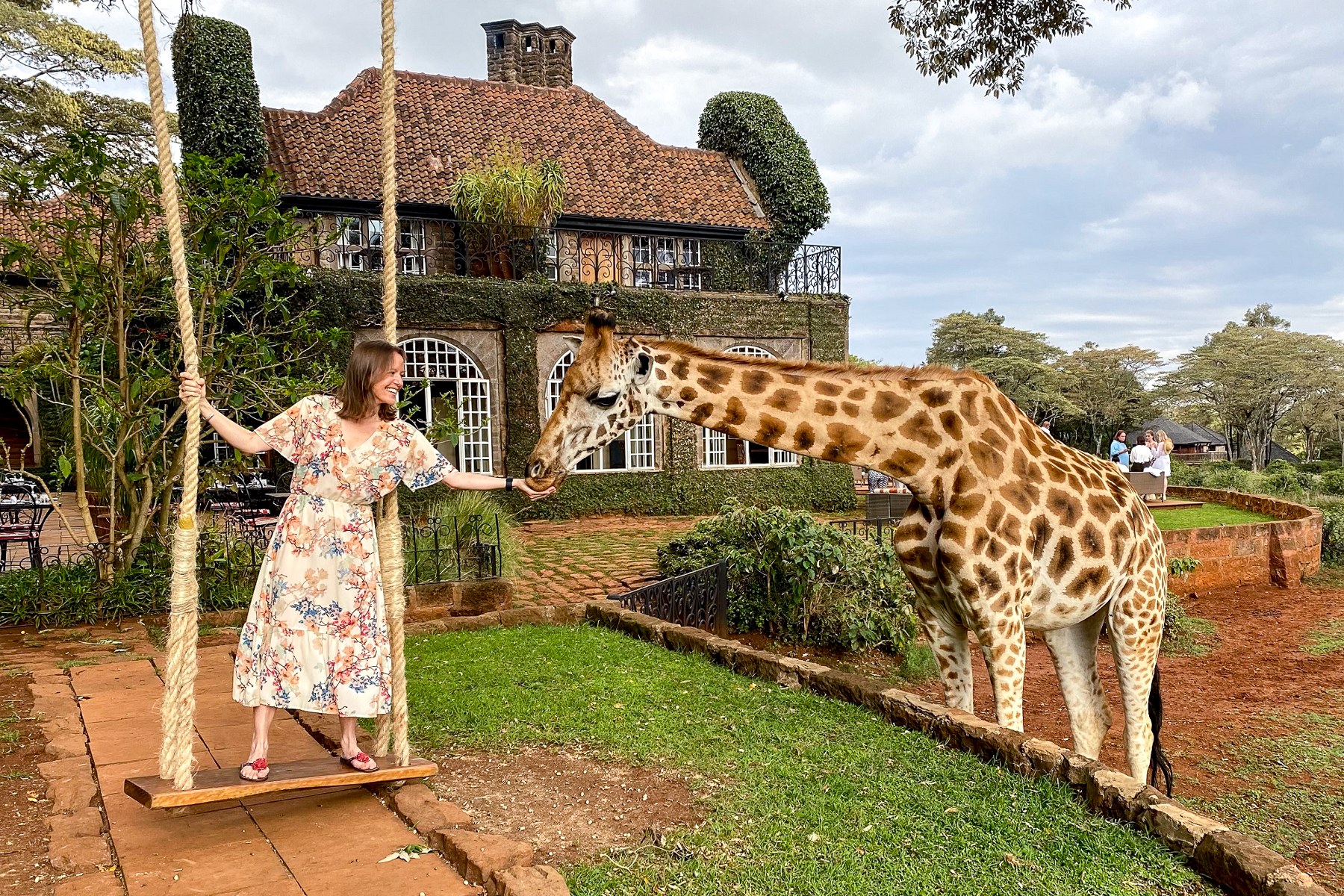 Samantha Gordon, Red Savannah's Regional Director for Africa, with a giraffe