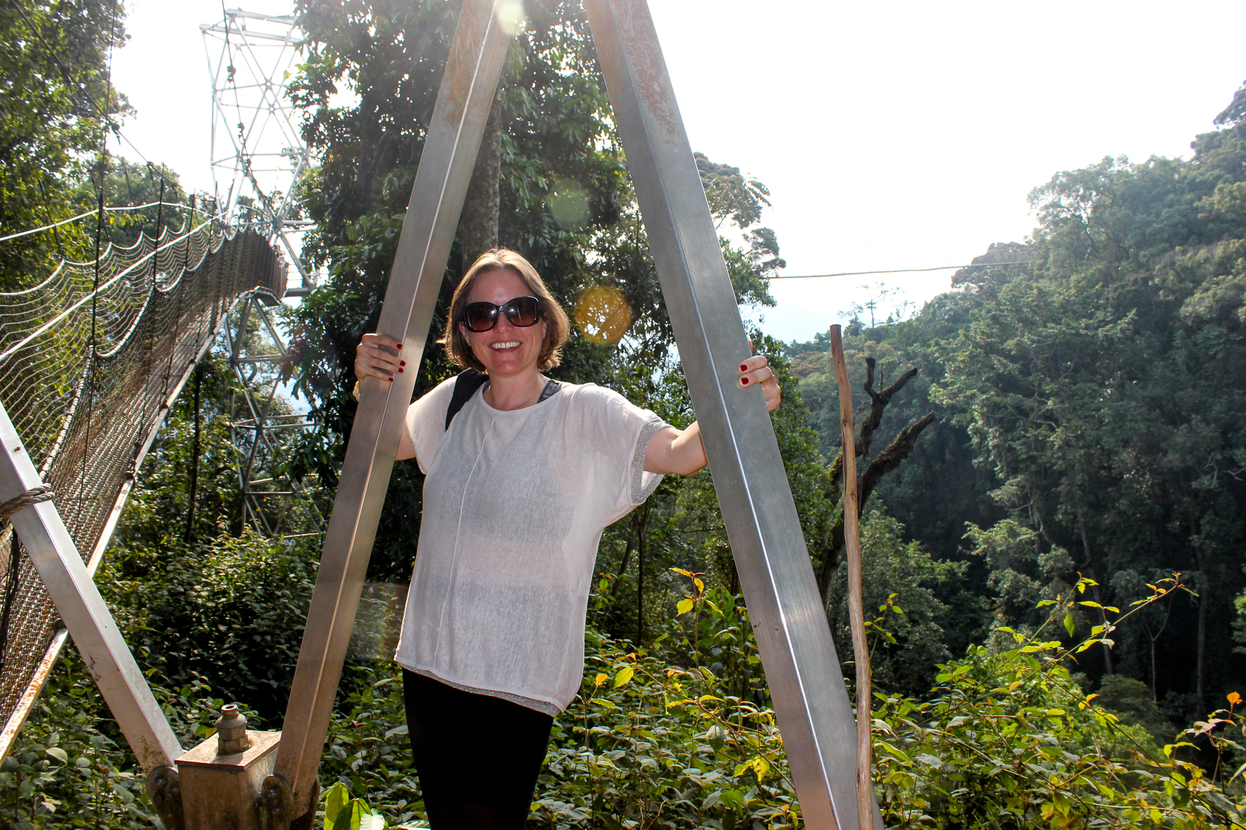 Samantha Gordon, Red Savannah's Regional Director for Africa, on a hanging bridge in Rwanda