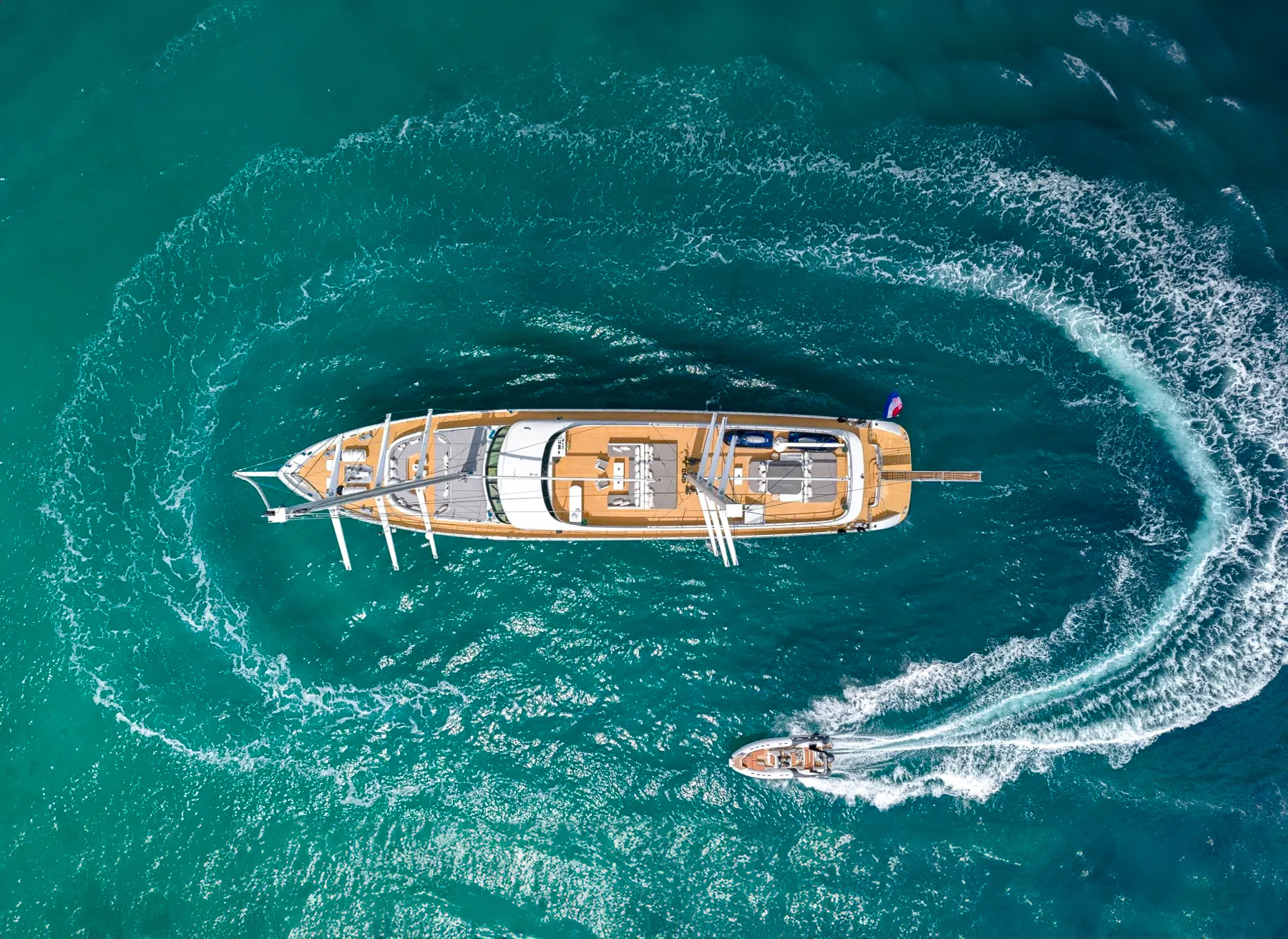 Bird's eye view of a jet ski circling the Aurum Sky luxury yacht in Croatia