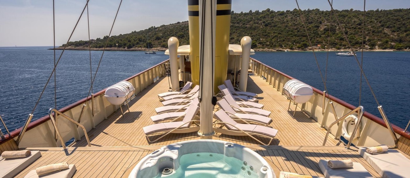 Jacuzzi on the deck of luxury gulet Casablanca with numerous sun loungers