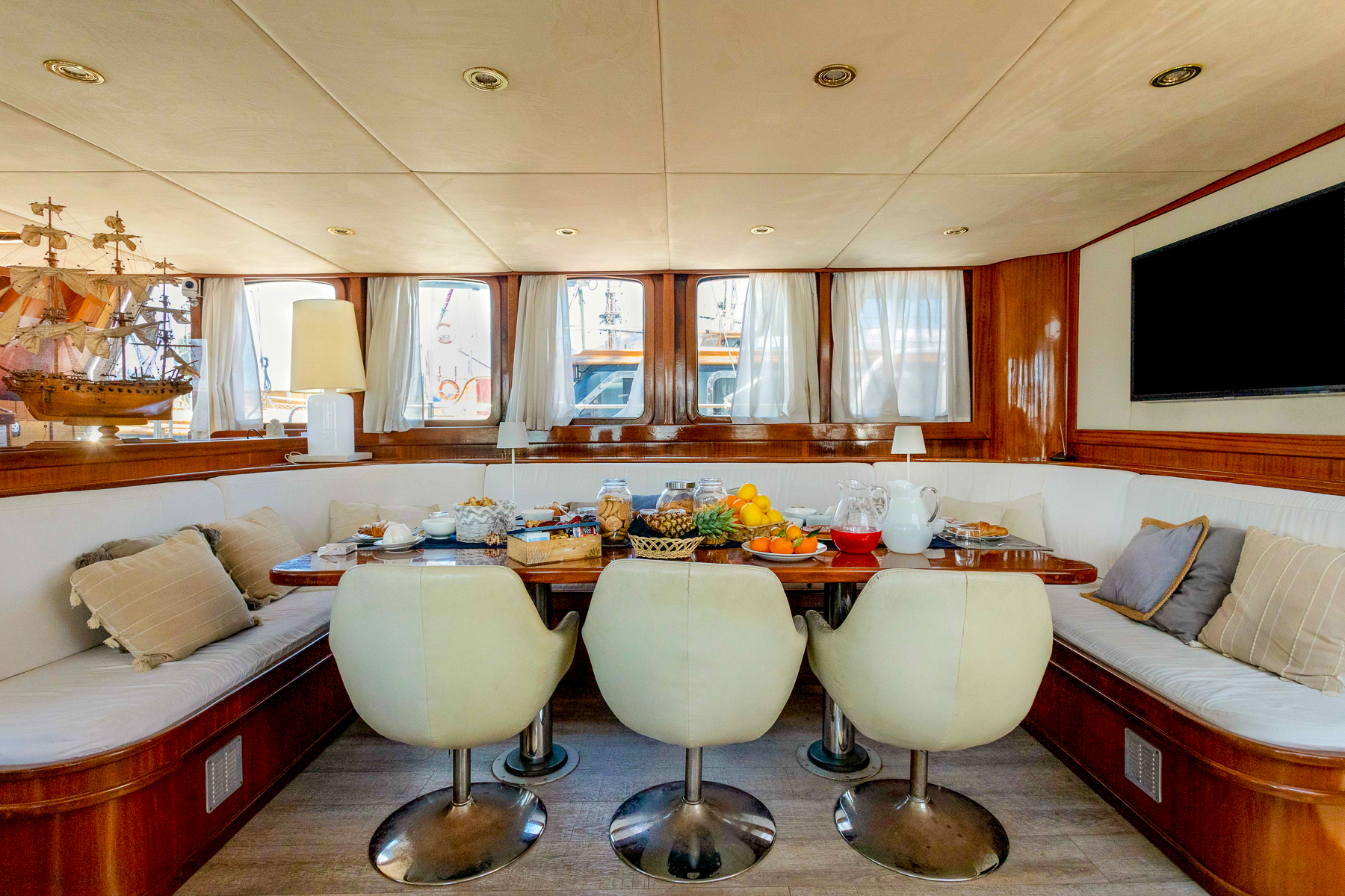 Dining table in the saloon onboard the DVI Marije luxury gulet in Italy
