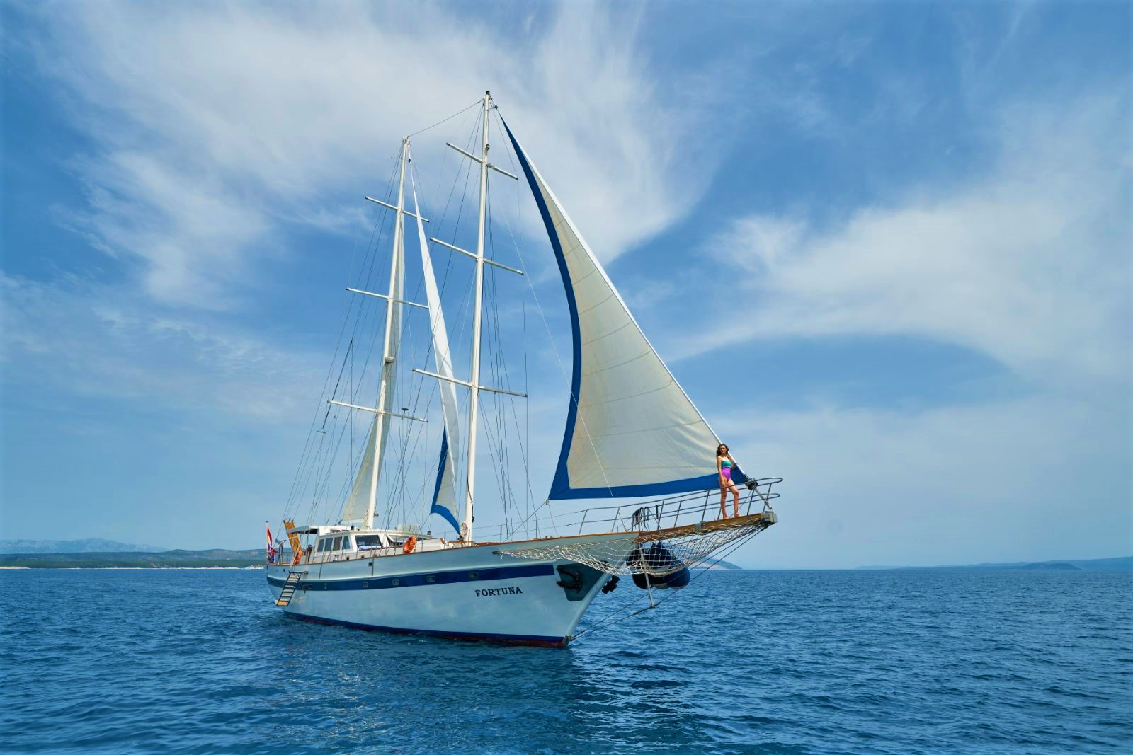 Exterior view of te Fortuna gulet with its sails up at sea in Croatia
