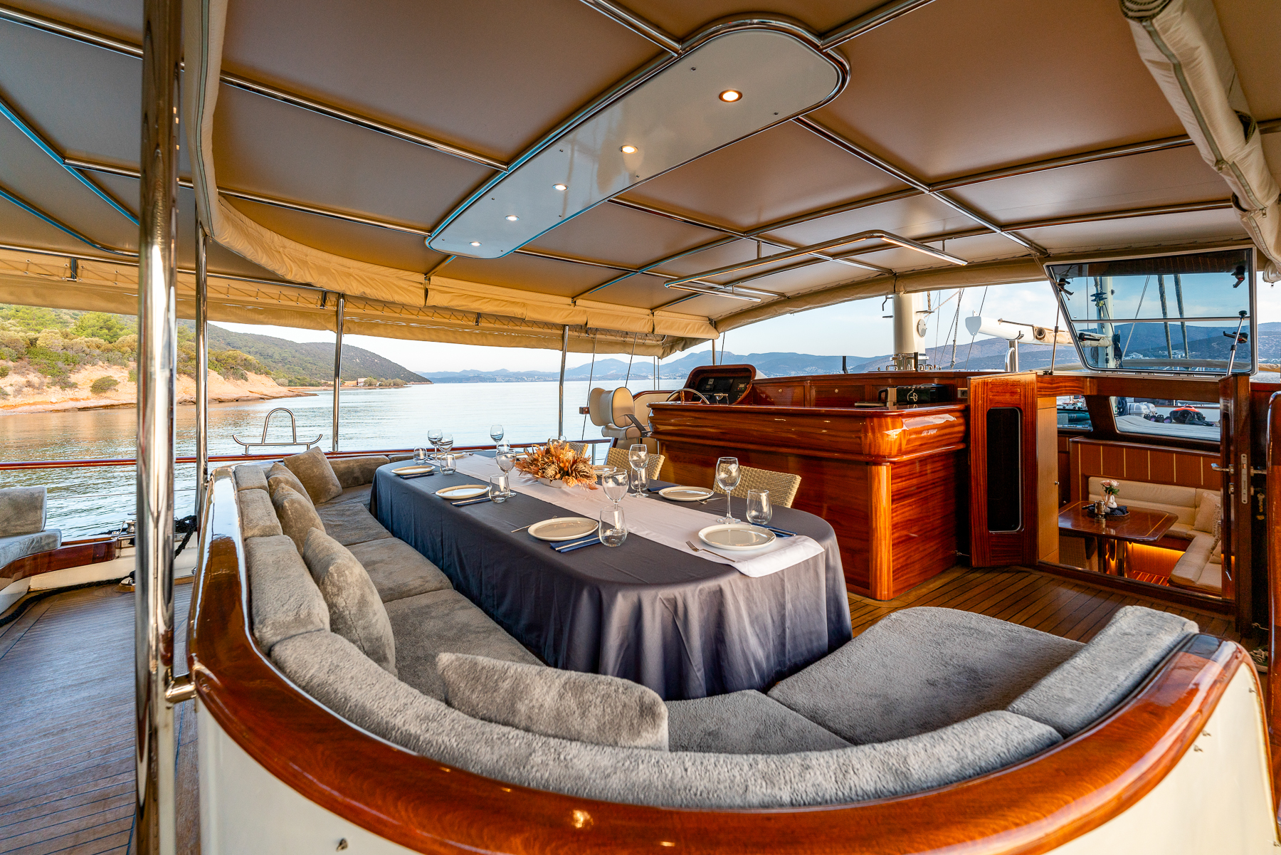 Alfresco sofa seating and dining area onboard the Gozdem the One luxury yacht in Turkey