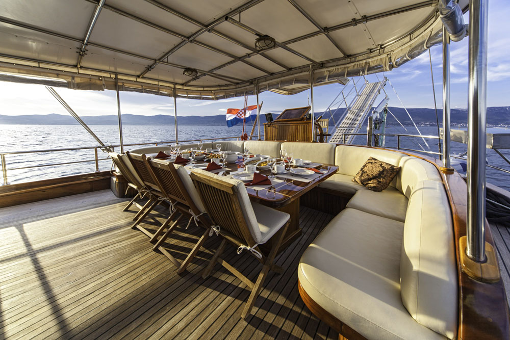 Table set up for outdoor dining on the Libra gulet in Croatia
