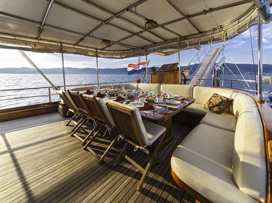 Table set up for outdoor dining on the Libra gulet in Croatia