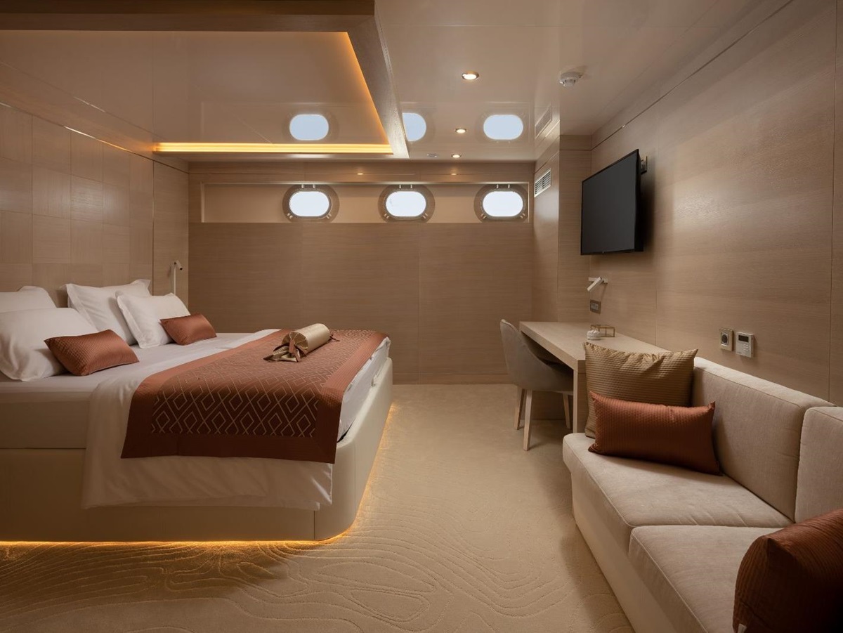 Guest cabin bed and seating onboard the Love Story gulet in Croatia