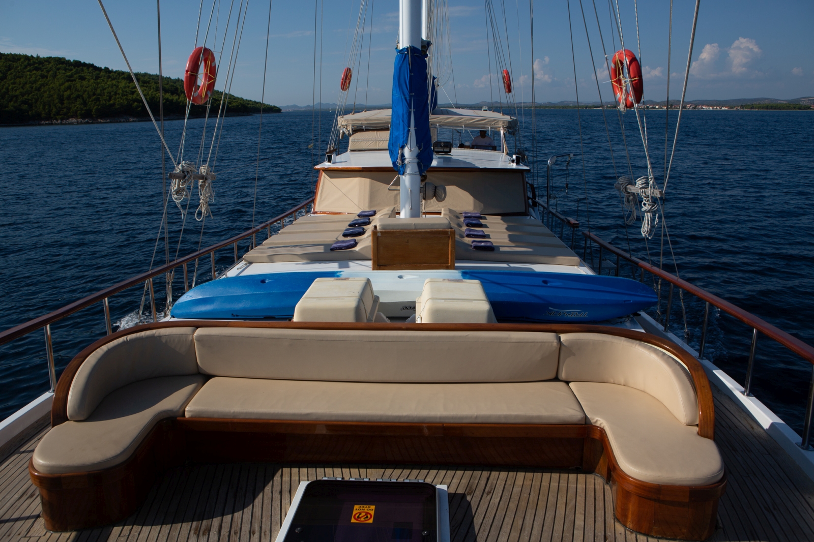 View over the deck of luxury gulet Malena with seating area and loungers