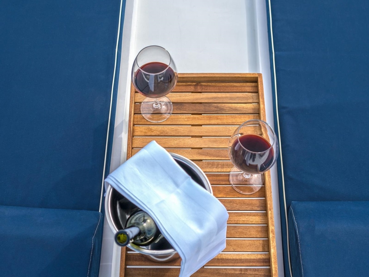 Two loungers, a chilled bottle of wine and two wine glasses on the luxury gulet Maske