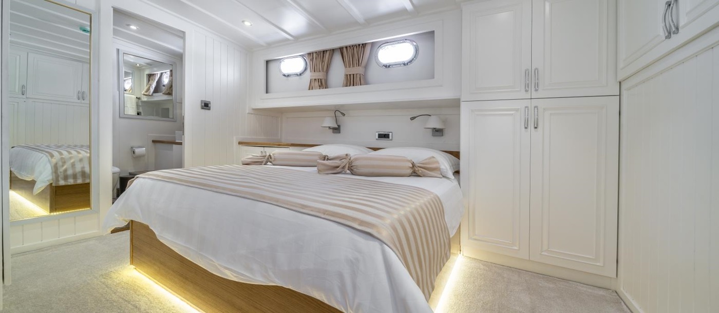 Master cabin with spacious storage onboard the luxury gulet Maske