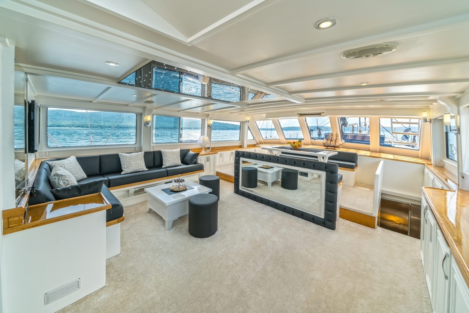 Modern salon of the luxury gulet Maske with panoramic windows and flatscreen tv