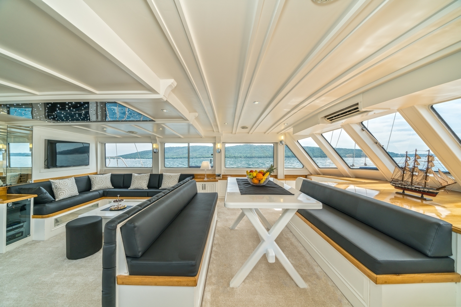 Modern salon of the luxury gulet Maske with panoramic windows and flatscreen tv