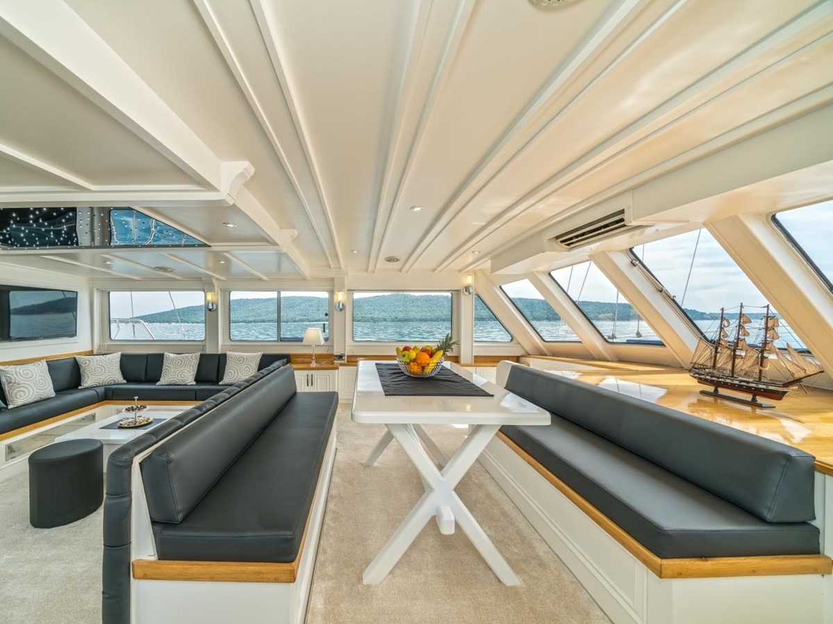 Modern salon of the luxury gulet Maske with panoramic windows and flatscreen tv