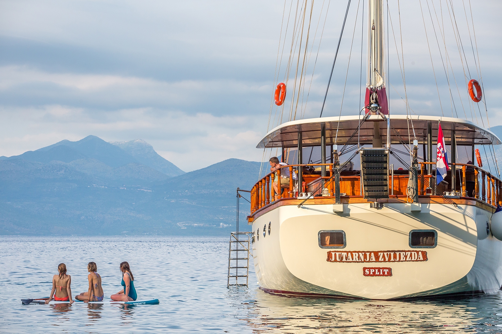 Rear view of Morning Star with people in the water in Croatia