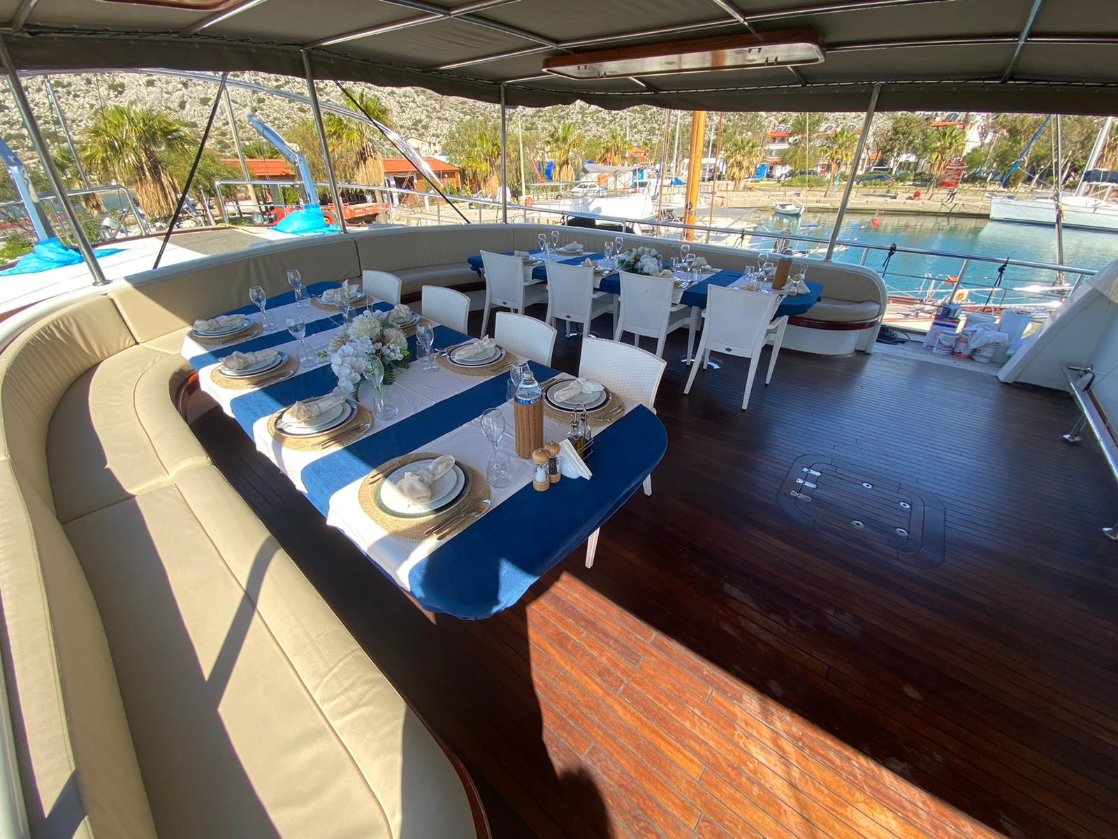 Spacious dining area with seating for sixteen people onboard the luxury gulet Nevra Queen