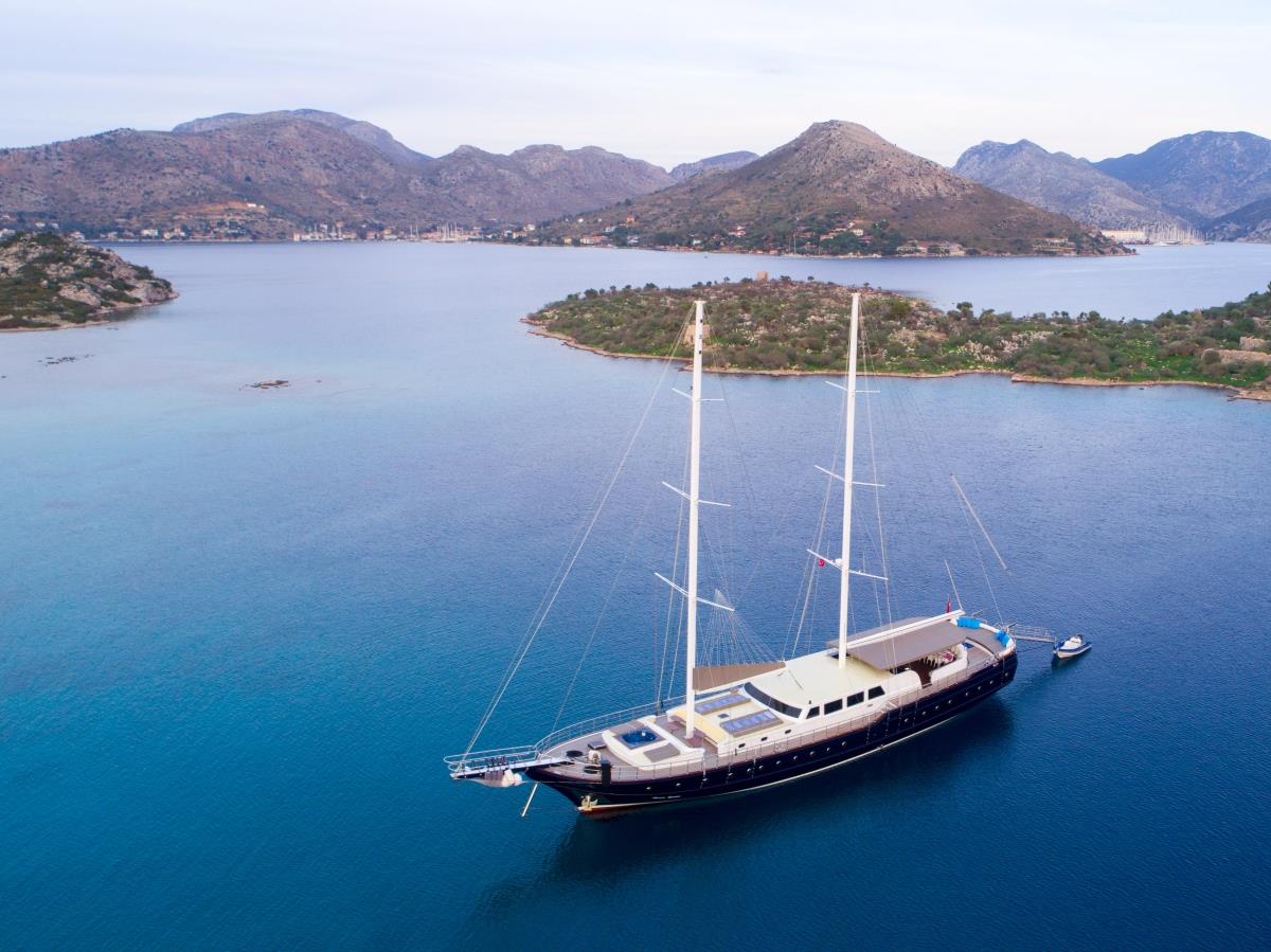 Aerial shot of luxury gulet Nevra Queen anchored off Turkish islands in the Mediterranean Sea