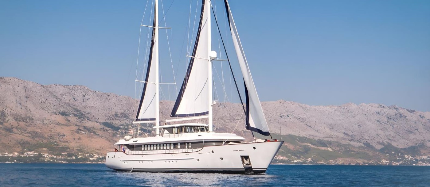 Exterior view of the Omnia gulet with sails up in Croatia