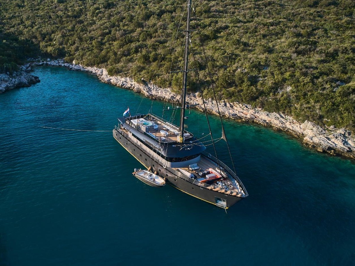 Exterior view of Rara Avis gulet and zodiac at bay in Croatia