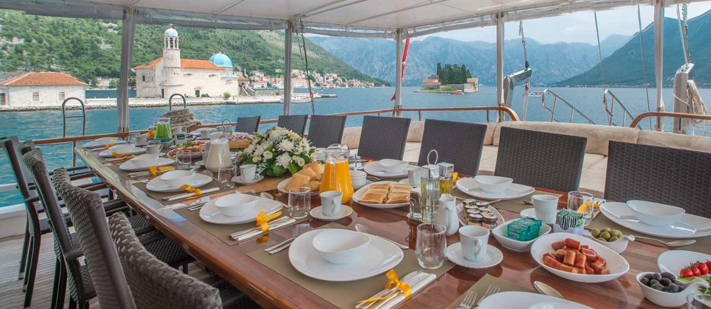 Table set for breakfast on the deck of luxury gulet Sadri Usta