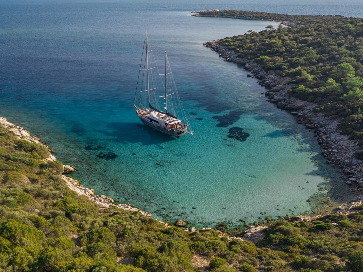 the luxury gulet Virtuoso anchored in a bay off the shore of Greece