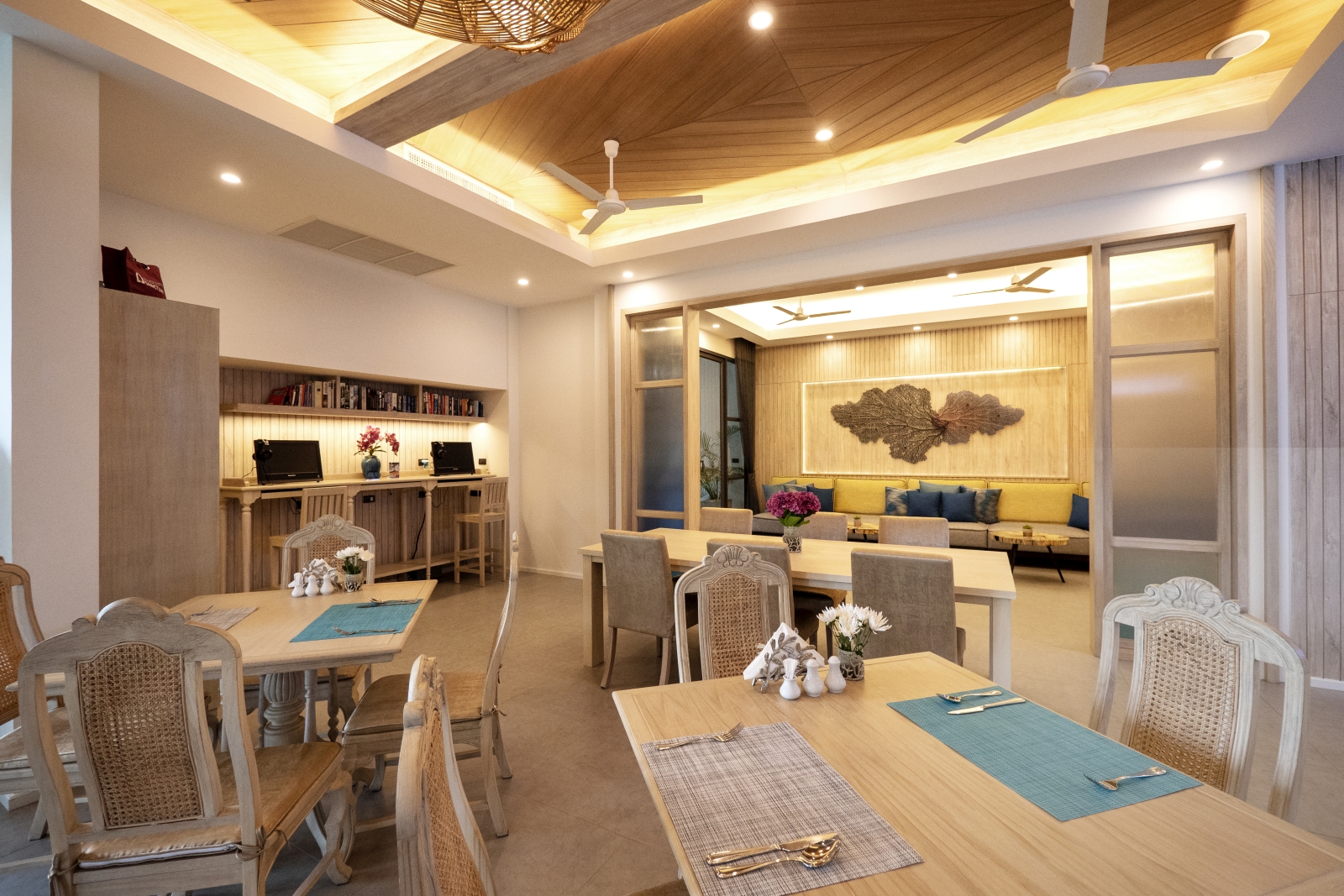 Dining area with a neutral/pastel colour scheme and light wood furnitre at luxury Zen resort Absolute Sanctuary in Thailand
