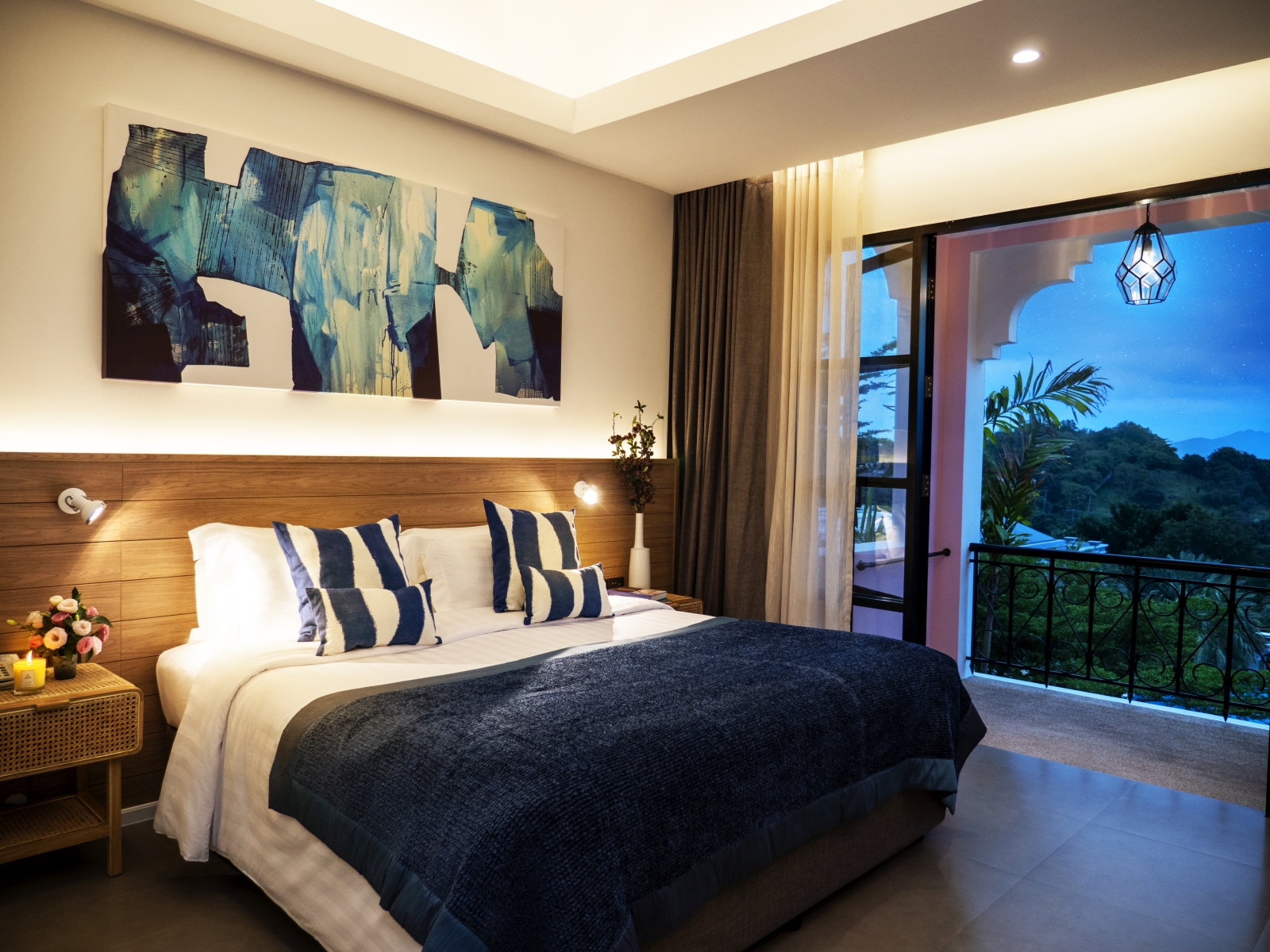 Double bedroom at luxury Zen resort Absolute Sanctuary in Thailand with private balcony and a black white and blue colour scheme
