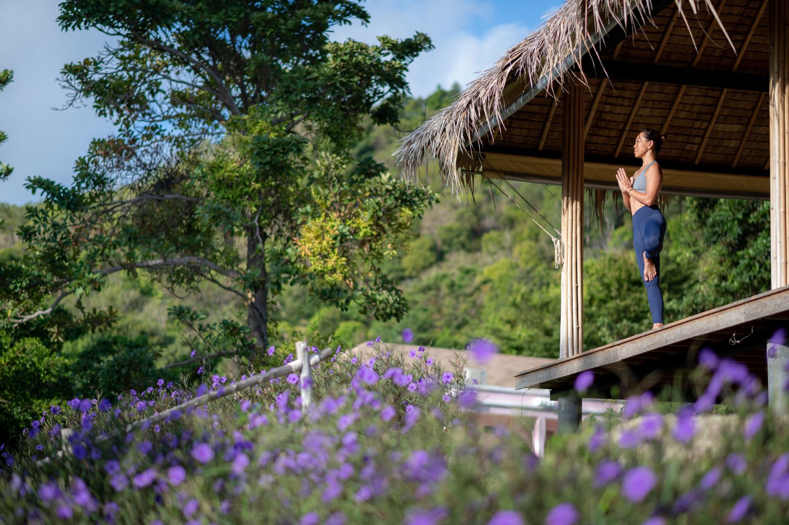 Guest practising yoga in the open-air yoga pavilion at luxury wellness resort Absolute Sanctuary in Thailand